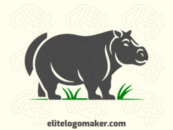 Abstract logo created with abstract shapes forming a hippo walking with green and grey colors.